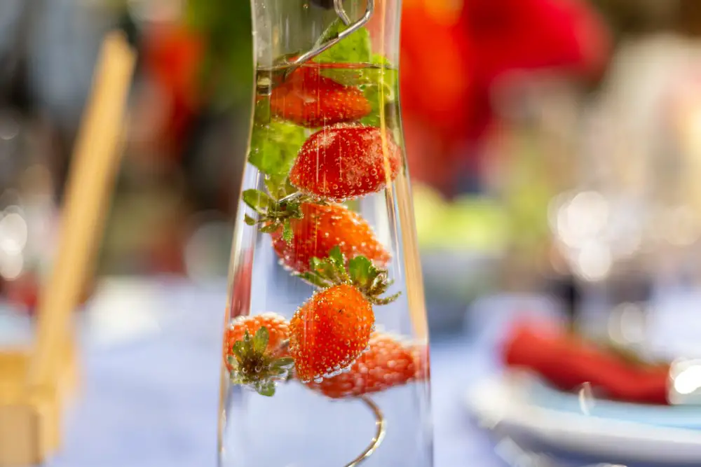 carafe-filled-water-strawberries-stands-on