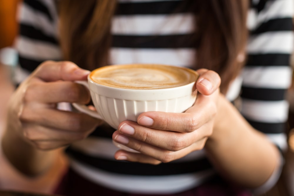 white-hot-coffee-cup-woman-hand