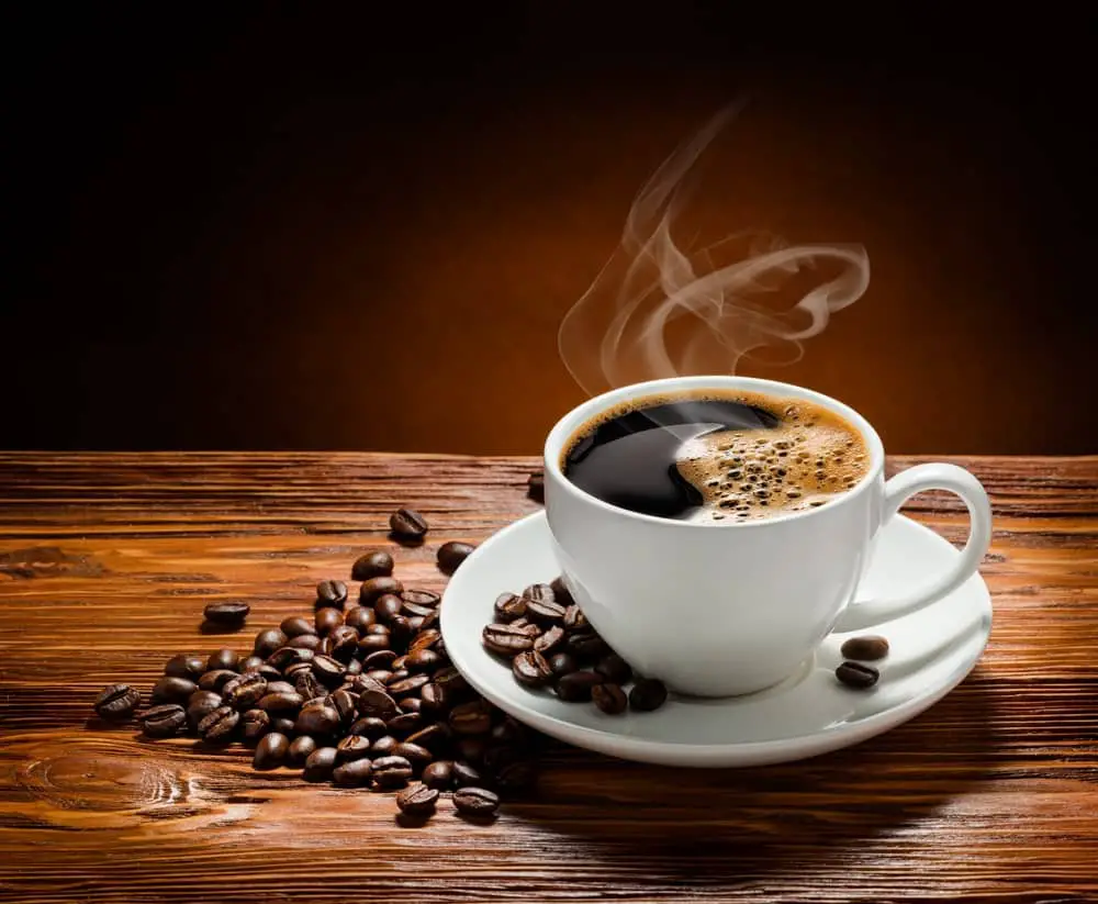 coffee-cup-beans-on-wooden-background