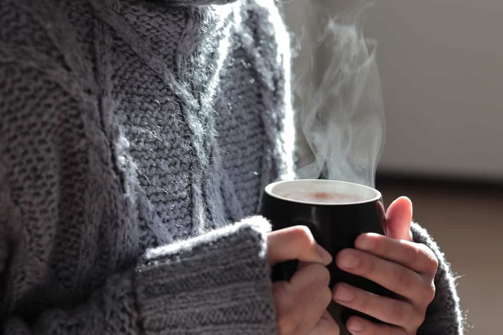 female-hands-hold-cup-hot-coffee