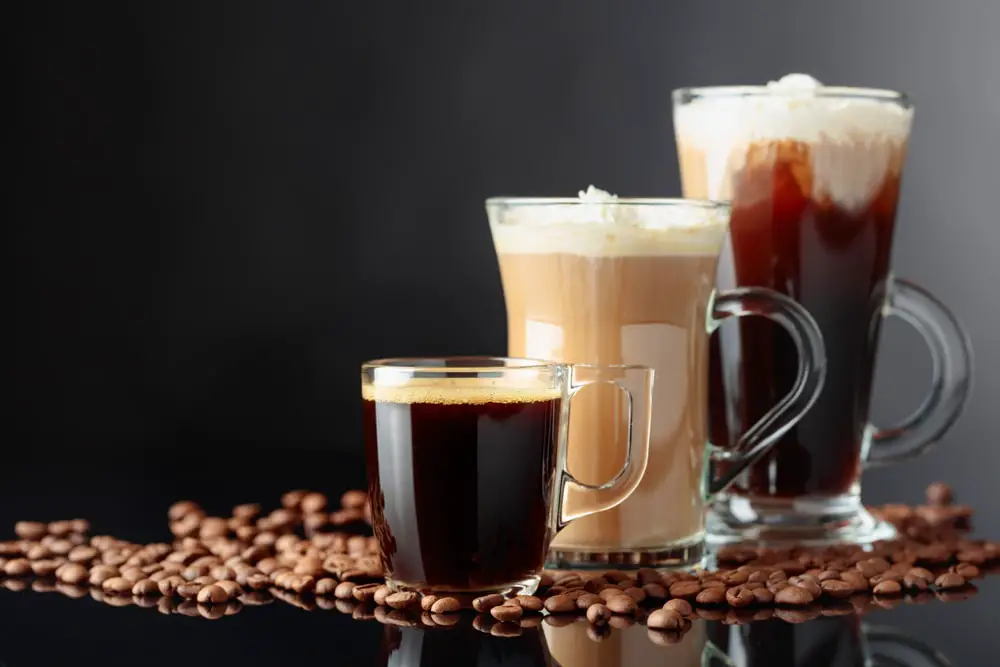various-coffee-drinks-on-black-reflective