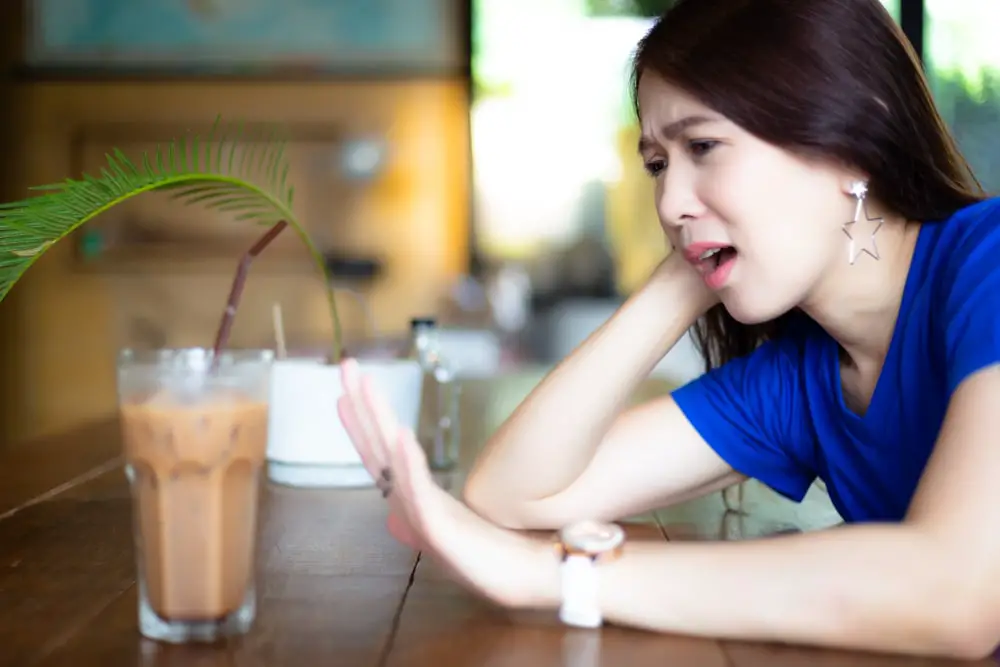 Attractive woman deny to drinking ice coffee because it’s not good for health