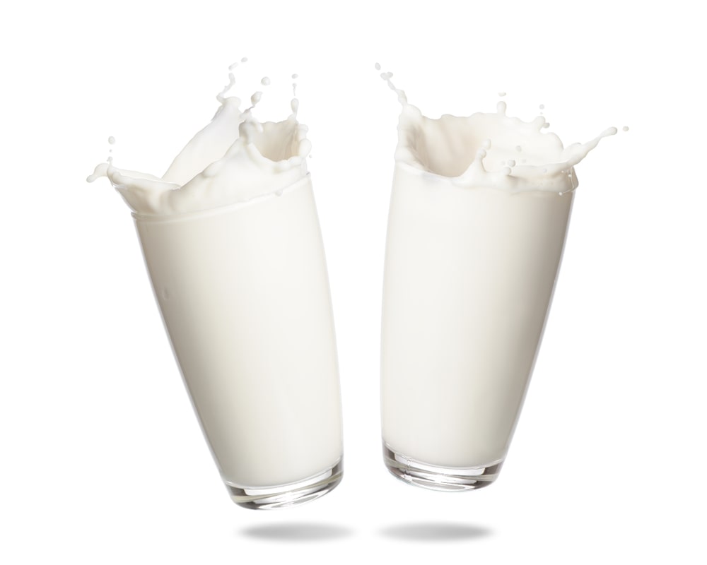 couple-milk-splashing-out-glass-isolated