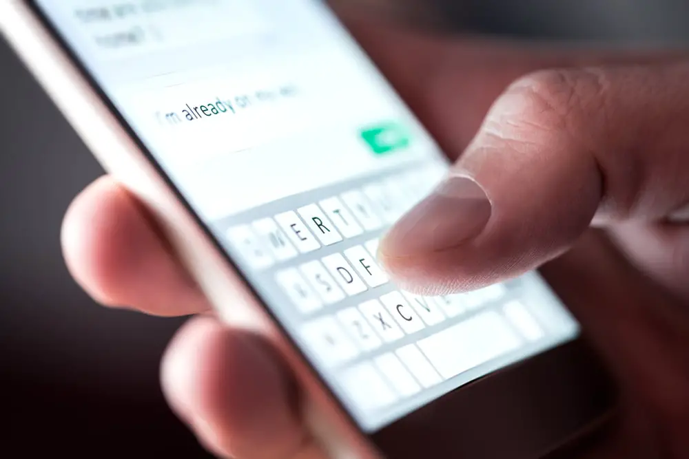 man-sending-text-message-sms-smartphone