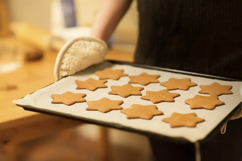 woman-baking-ginger-bread-stars-christmas