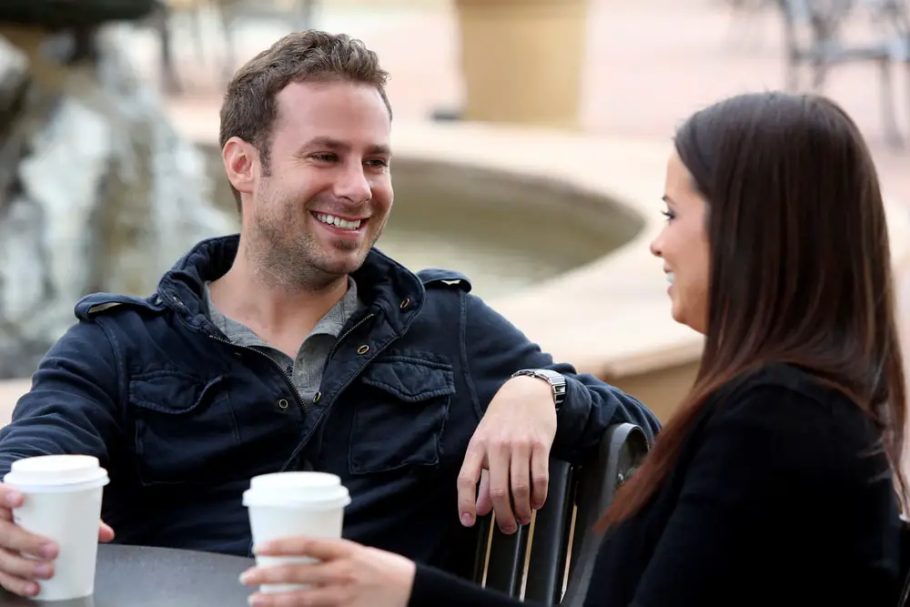 young-couple-drinking-coffee-outside