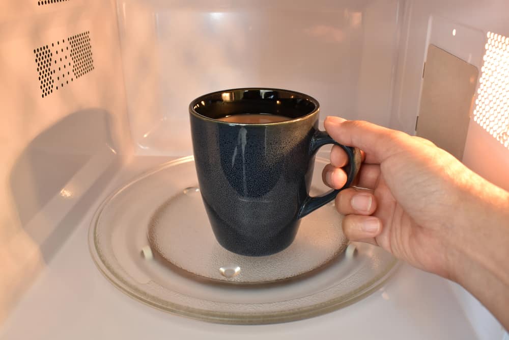 Cup of tea or coffee in microwave