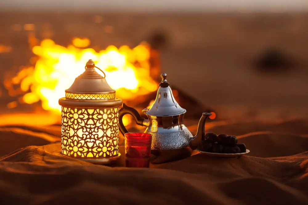 dates-teapot-cup-tea-near-fire