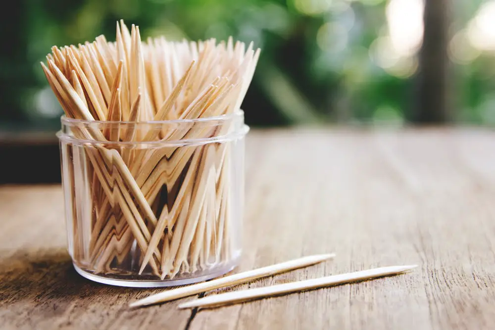 toothpicks-on-wooden-table-background-close