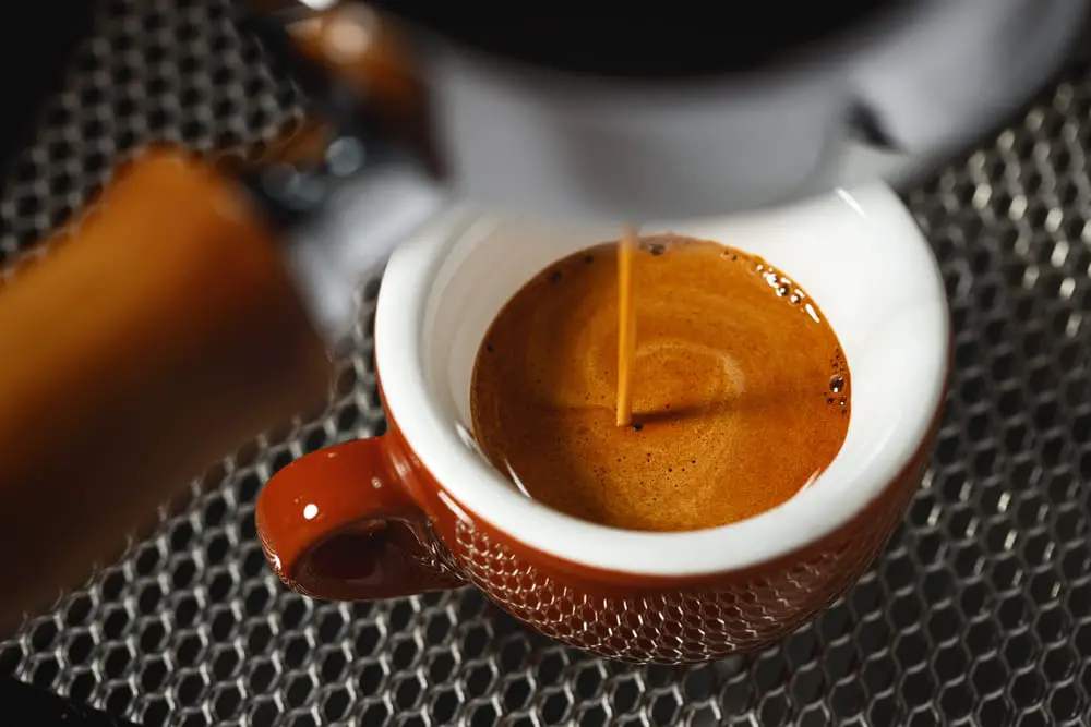 brew-espresso-coffee-machine-into-brown