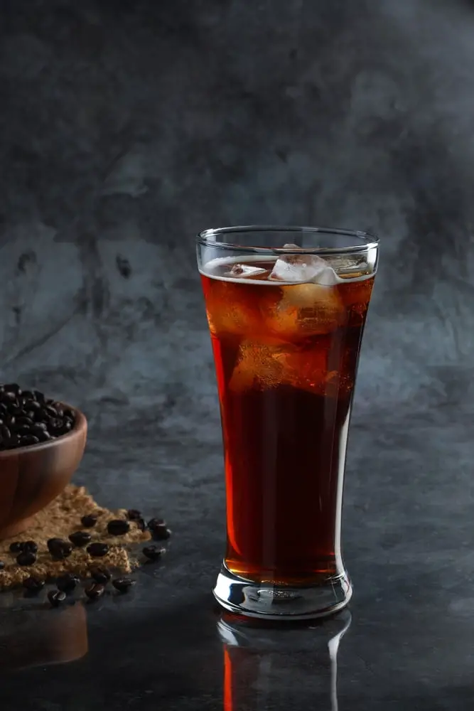 iced-americano-coffee-glass-beans-background