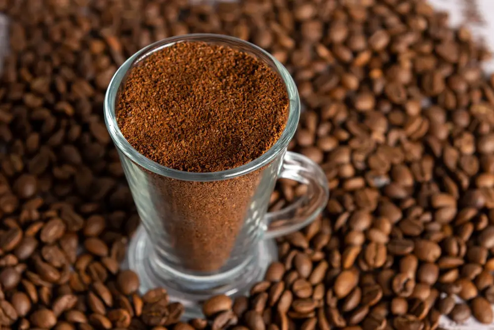 transparent-glass-cup-filled-ground-coffee