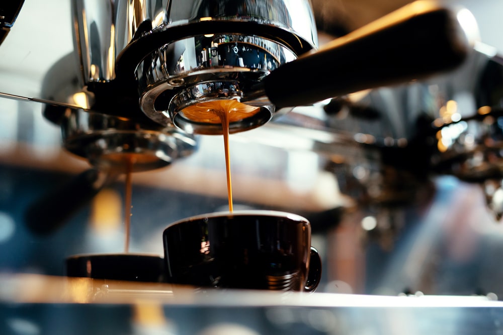 close-espresso-pouring-coffee-machine-professional
